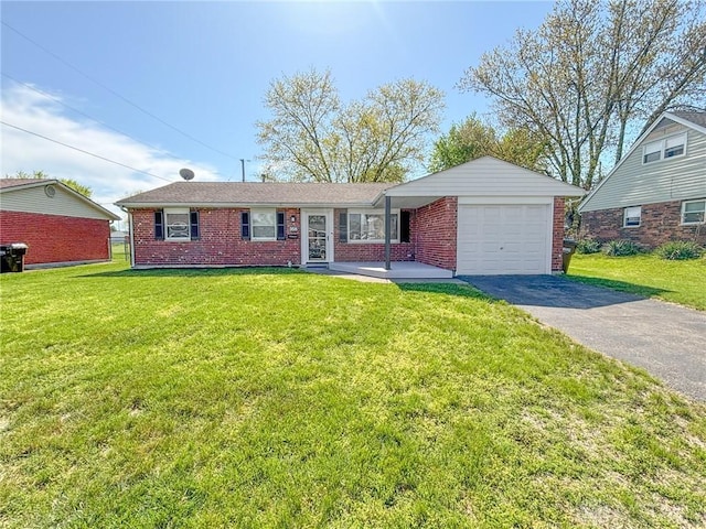 ranch-style home with an attached garage, a front yard, driveway, and brick siding