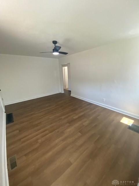 944 Wilmington Ave, Dayton, OH 45420 - unfurnished room with baseboards, dark wood-style floors, and a ceiling fan