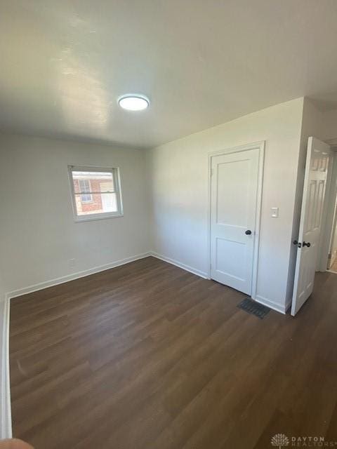 944 Wilmington Ave, Dayton, OH 45420 - unfurnished room featuring baseboards and dark wood-style floors