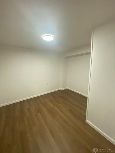 944 Wilmington Ave, Dayton, OH 45420 - spare room featuring dark wood-type flooring and baseboards