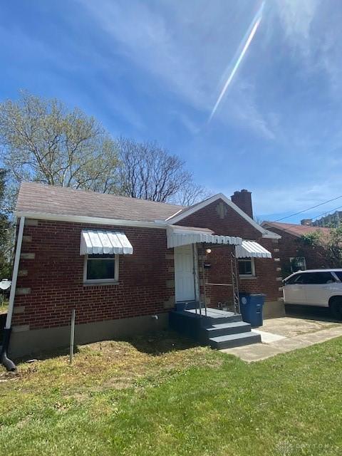 944 Wilmington Ave, Dayton, OH 45420 - view of front of home with brick siding and a front yard