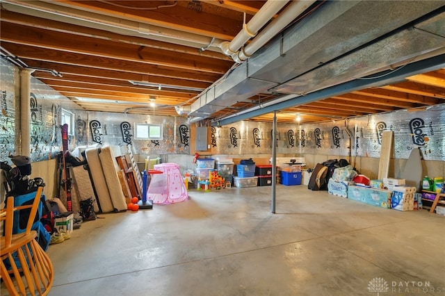 basement featuring electric panel