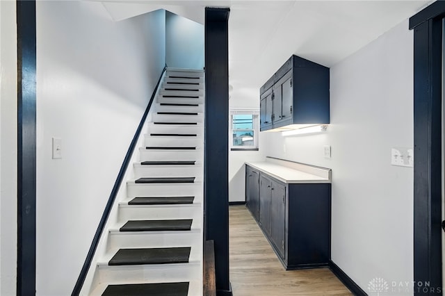 131 Hamilton St, West Milton, OH 45383 - staircase featuring wood finished floors and baseboards