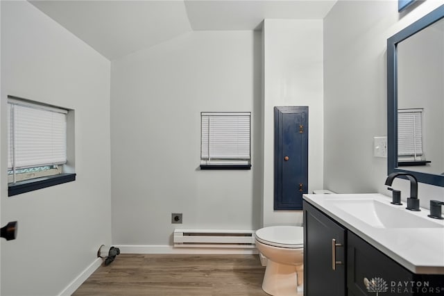 131 Hamilton St, West Milton, OH 45383 - bathroom with a baseboard heating unit, vanity, wood finished floors, and lofted ceiling