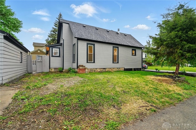 131 Hamilton St, West Milton, OH 45383 - rear view of house featuring a shingled roof and a yard