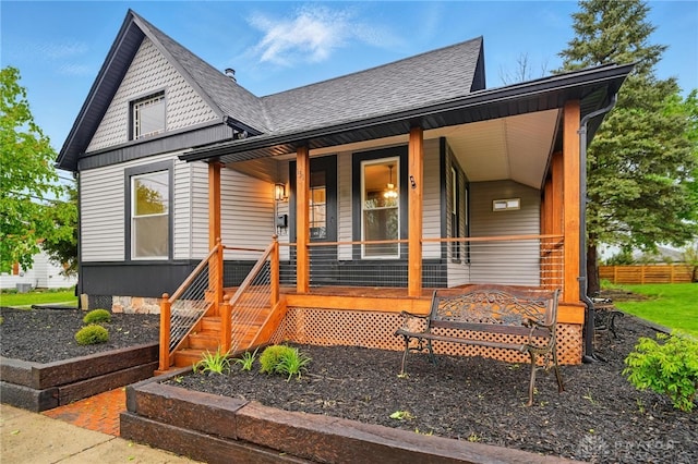 131 Hamilton St, West Milton, OH 45383 - view of front of home with a shingled roof and a porch