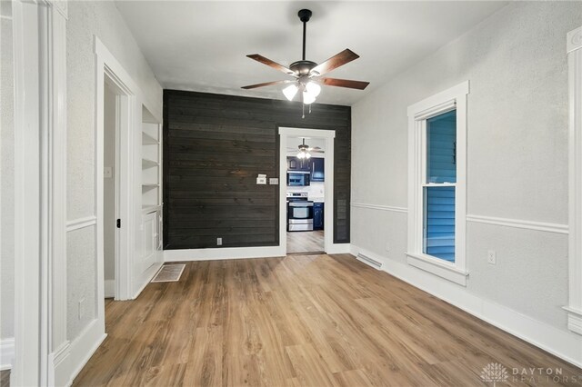 131 Hamilton St, West Milton, OH 45383 - empty room with a ceiling fan and wood finished floors