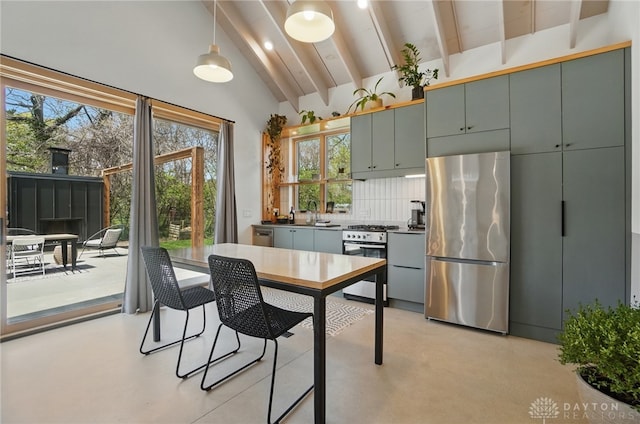 kitchen with decorative backsplash, beamed ceiling, stainless steel appliances, and a wealth of natural light