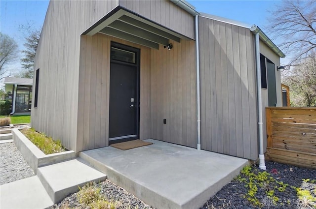 view of outbuilding featuring fence
