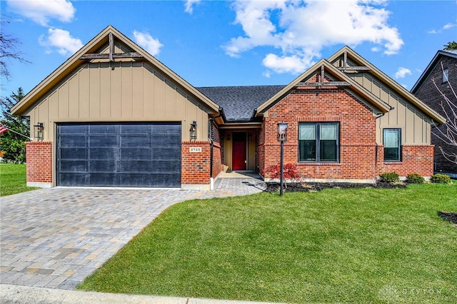 craftsman-style home with brick siding, an attached garage, a front lawn, and board and batten siding