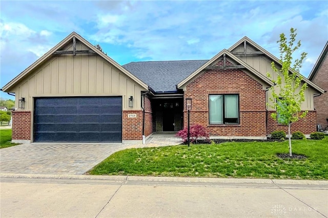 2725 Terraceview Cir, Beavercreek, OH 45431 - view of front of house featuring brick siding, a front lawn, an attached garage, driveway, and board and batten siding