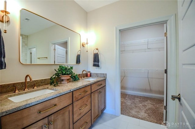 2725 Terraceview Cir, Beavercreek, OH 45431 - full bathroom featuring double vanity, tile patterned floors, and a walk in closet