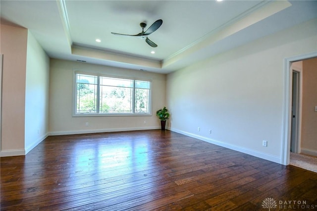 2725 Terraceview Cir, Beavercreek, OH 45431 - empty room featuring a tray ceiling, a ceiling fan, dark wood-type flooring, crown molding, and recessed lighting