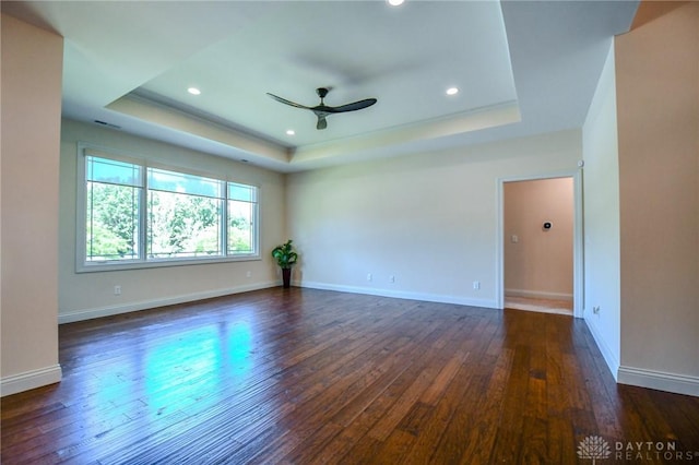 2725 Terraceview Cir, Beavercreek, OH 45431 - unfurnished room with a tray ceiling, a ceiling fan, dark wood-style flooring, and recessed lighting