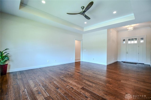 2725 Terraceview Cir, Beavercreek, OH 45431 - spare room with a tray ceiling, ornamental molding, dark wood-type flooring, a ceiling fan, and recessed lighting