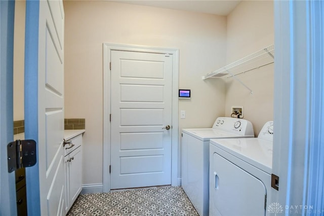 2725 Terraceview Cir, Beavercreek, OH 45431 - laundry area featuring washer and clothes dryer and cabinet space