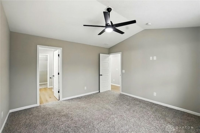 2061 Pine Forest Dr, Miamisburg, OH 45342 - unfurnished bedroom with baseboards, light carpet, and lofted ceiling