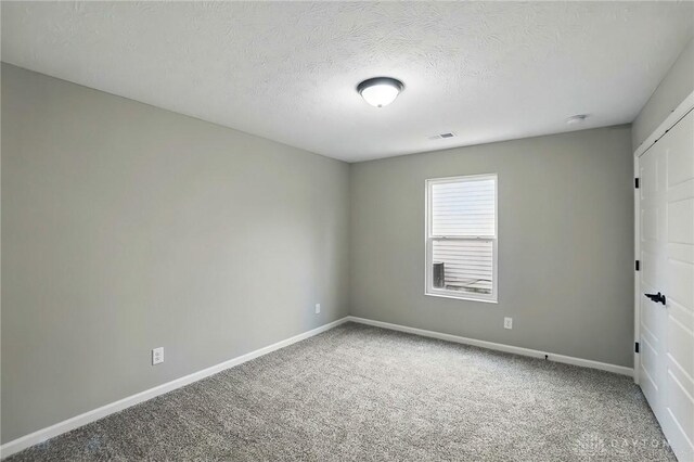 2061 Pine Forest Dr, Miamisburg, OH 45342 - spare room featuring carpet flooring, baseboards, and visible vents