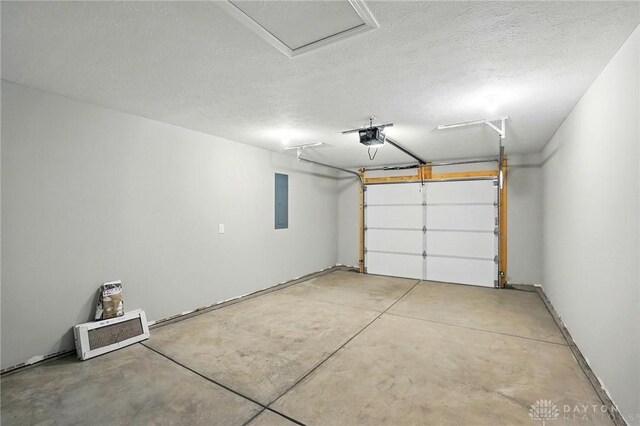 2061 Pine Forest Dr, Miamisburg, OH 45342 - garage featuring a garage door opener and electric panel