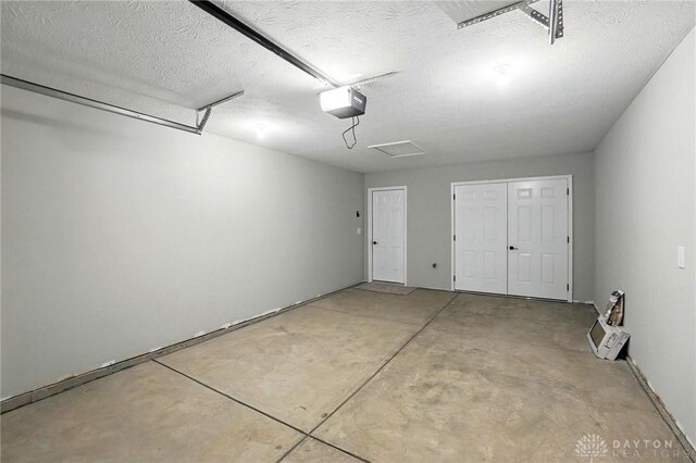 2061 Pine Forest Dr, Miamisburg, OH 45342 - garage featuring a garage door opener