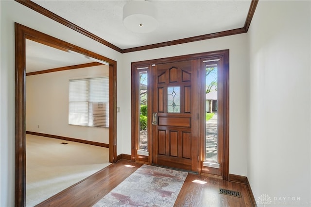 734 Pine Needles Dr, Washington Twp, OH 45458 - foyer entrance with baseboards, plenty of natural light, wood finished floors, and visible vents