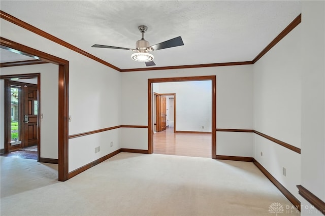 734 Pine Needles Dr, Washington Twp, OH 45458 - spare room with crown molding, baseboards, ceiling fan, and light carpet