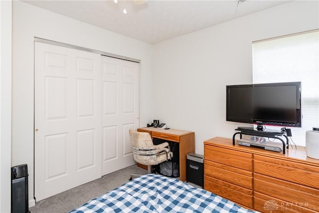 carpeted bedroom with a closet