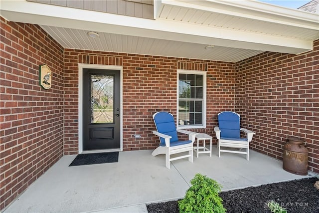 838 W Bentley Cir, Troy, OH 45373 - entrance to property featuring brick siding and a patio area