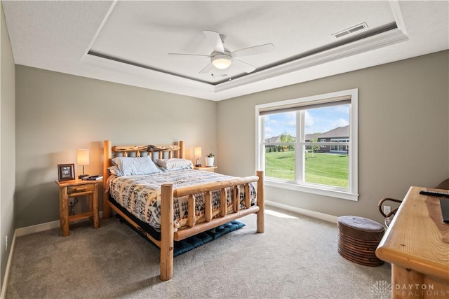 838 W Bentley Cir, Troy, OH 45373 - carpeted bedroom with a ceiling fan, baseboards, visible vents, and a raised ceiling