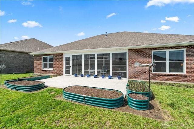 838 W Bentley Cir, Troy, OH 45373 - rear view of property with a lawn, brick siding, a shingled roof, and a patio