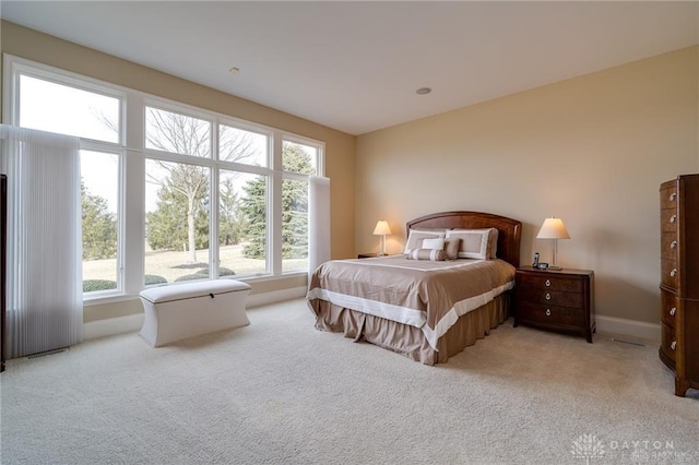 835 Vintage Green Way, Centerville, OH 45458 - bedroom featuring multiple windows, light carpet, and baseboards