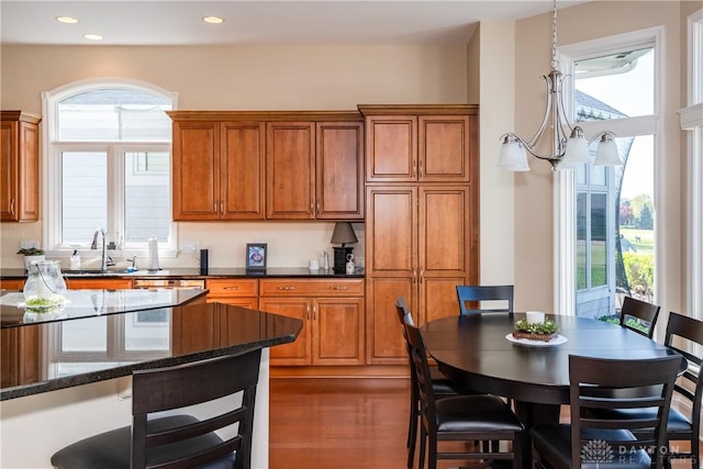 835 Vintage Green Way, Centerville, OH 45458 - kitchen with a sink, healthy amount of natural light, brown cabinetry, recessed lighting, and dark stone countertops