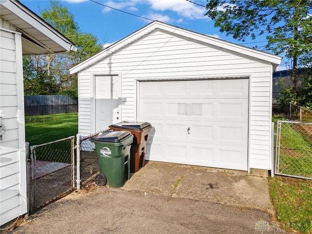 149 Poe Ln, Xenia, OH 45385 - detached garage with fence, a gate, and concrete driveway