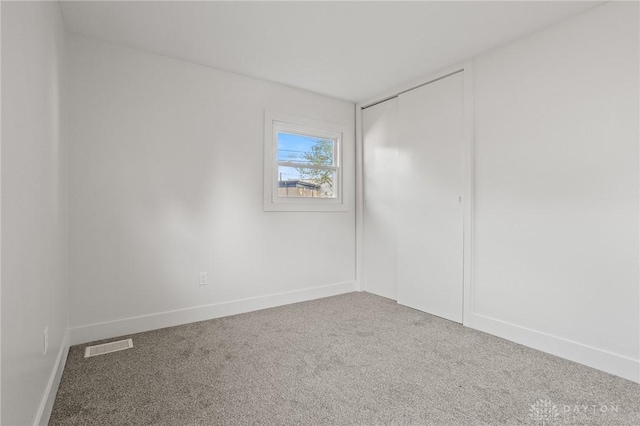 149 Poe Ln, Xenia, OH 45385 - carpeted empty room with baseboards and visible vents