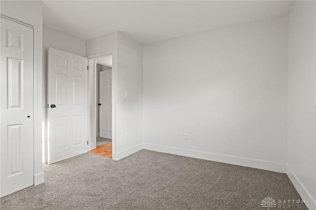 149 Poe Ln, Xenia, OH 45385 - unfurnished bedroom featuring carpet flooring and baseboards