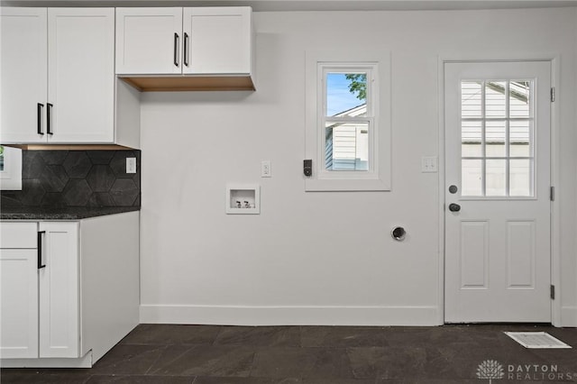 149 Poe Ln, Xenia, OH 45385 - washroom featuring cabinet space, baseboards, and washer hookup