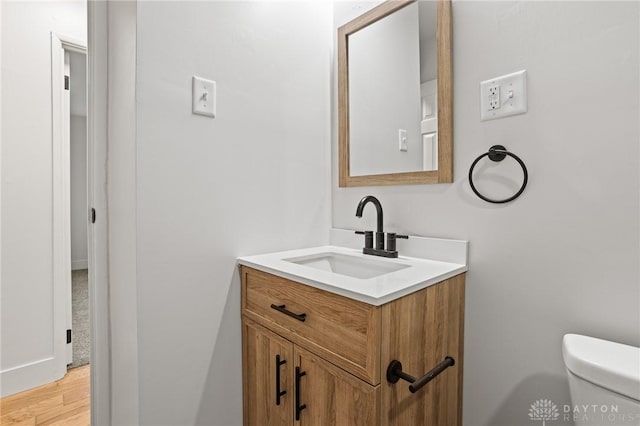 149 Poe Ln, Xenia, OH 45385 - bathroom with vanity, toilet, and wood finished floors