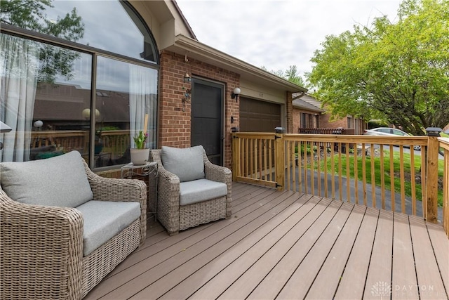 wooden deck featuring a garage