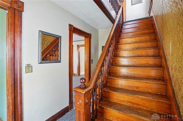 281 S Riverview Ave, Miamisburg, OH 45342 - staircase featuring carpet floors, baseboards, and wallpapered walls