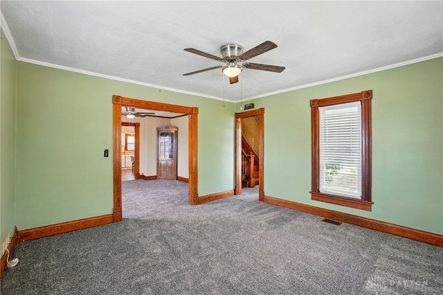 281 S Riverview Ave, Miamisburg, OH 45342 - unfurnished room with visible vents, crown molding, baseboards, a ceiling fan, and carpet