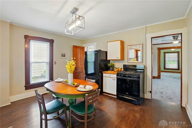 281 S Riverview Ave, Miamisburg, OH 45342 - kitchen with white cabinets, dark wood finished floors, ornamental molding, and black appliances