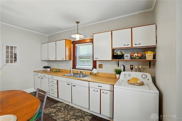 281 S Riverview Ave, Miamisburg, OH 45342 - kitchen featuring washer / dryer, light countertops, white cabinetry, a sink, and dark wood finished floors