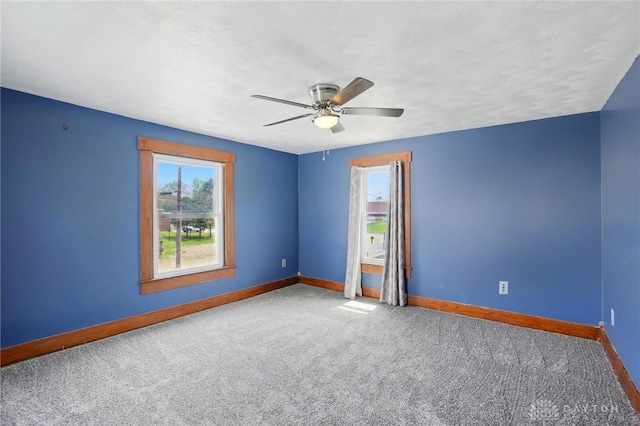 281 S Riverview Ave, Miamisburg, OH 45342 - spare room featuring baseboards, ceiling fan, and carpet flooring