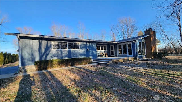 view of front of home with a chimney