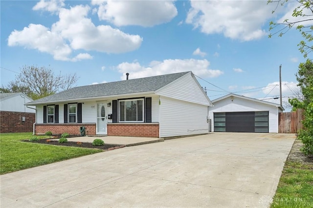 single story home featuring brick siding, a garage, fence, and a front yard