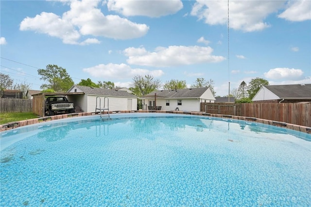 view of swimming pool featuring fence and a fenced in pool