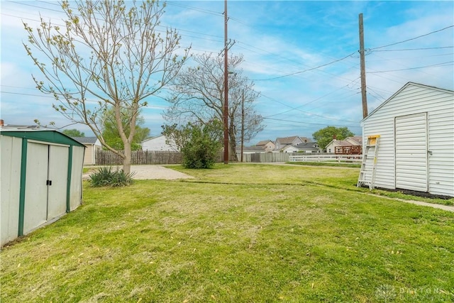 309 Staunton Rd, Piqua, OH 45356 - view of yard with a shed, an outbuilding, and fence