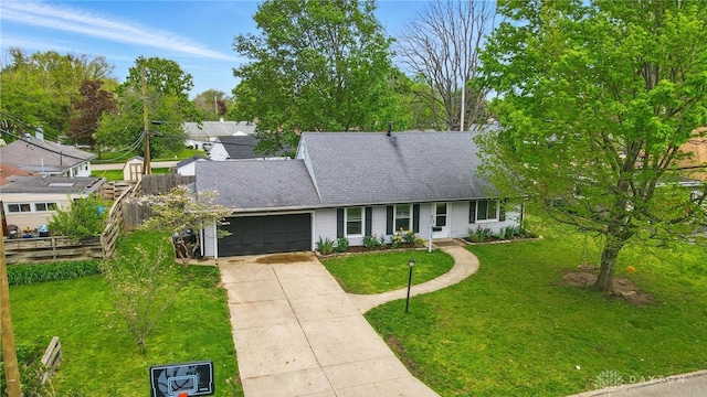 813 Kenosha Rd, Kettering, OH 45429 - ranch-style home featuring a garage, fence, a front yard, a shingled roof, and concrete driveway