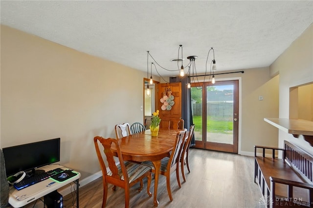 813 Kenosha Rd, Kettering, OH 45429 - dining room with a textured ceiling, baseboards, and light wood-type flooring