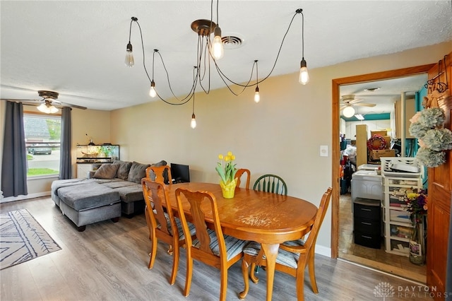 813 Kenosha Rd, Kettering, OH 45429 - dining area featuring a ceiling fan, visible vents, and light wood-style floors